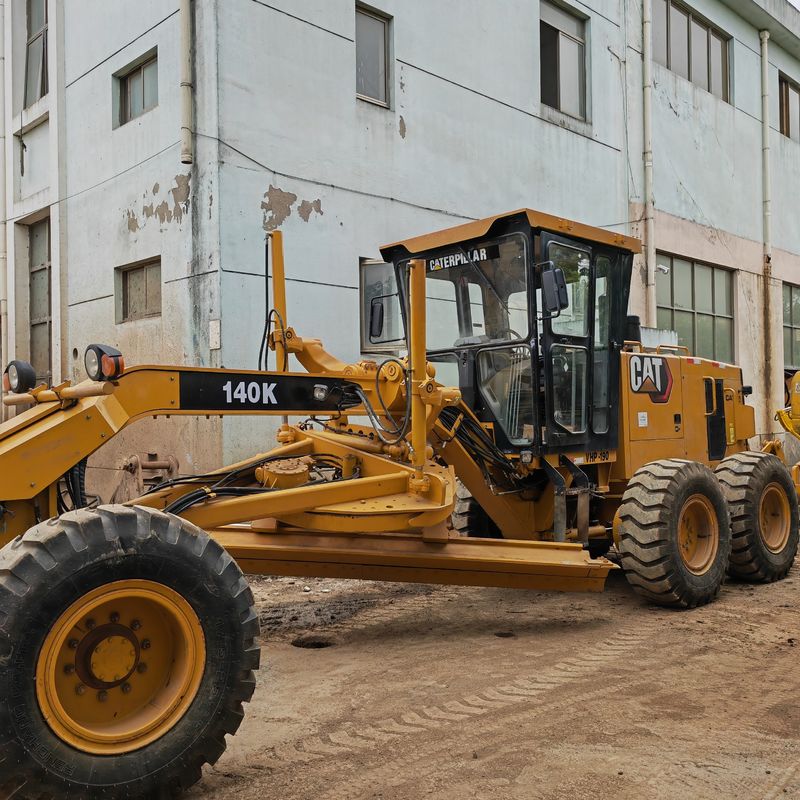 Digunakan excavator tanah leveler Caterpillar CAT140K roader mesin bekas mesin traktor Jepang dalam kondisi baik