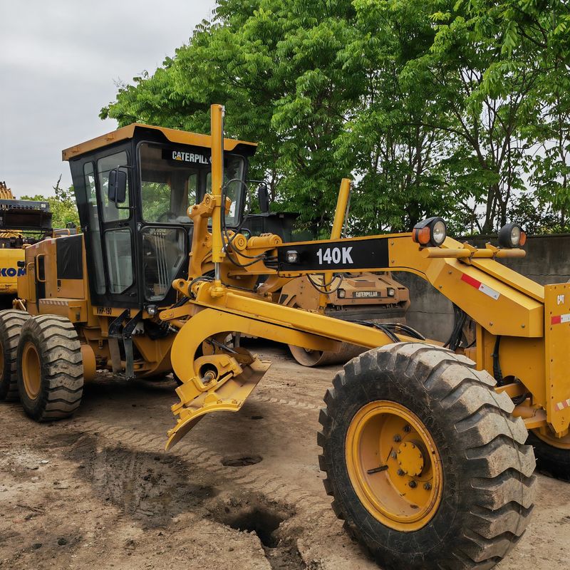 Digunakan excavator tanah leveler Caterpillar CAT140K roader mesin bekas mesin traktor Jepang dalam kondisi baik