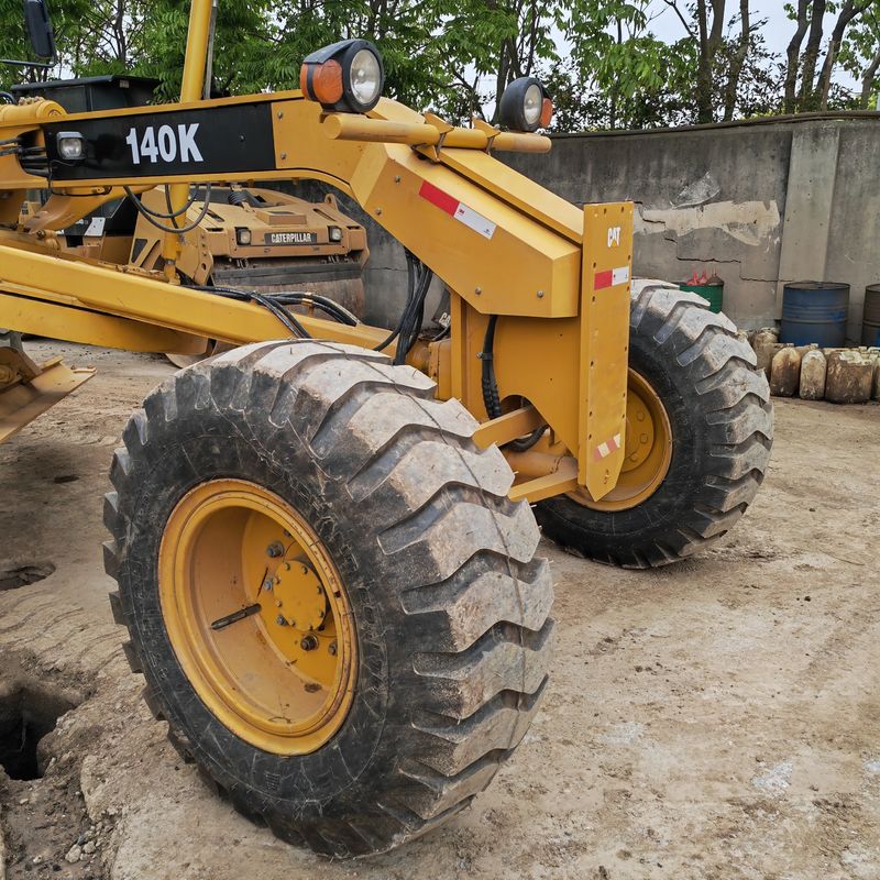 Digunakan excavator tanah leveler Caterpillar CAT140K roader mesin bekas mesin traktor Jepang dalam kondisi baik